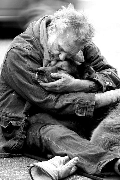 Man Hugging Dog